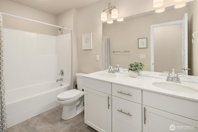 full bathroom featuring toilet, double vanity, shower / bath combo, and tile patterned floors