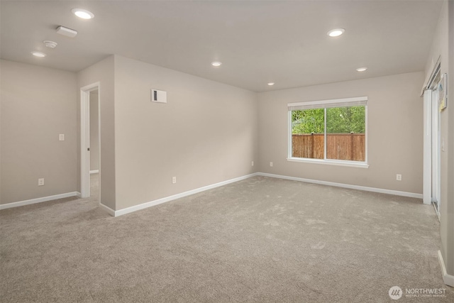 carpeted spare room with baseboards, recessed lighting, and a smoke detector