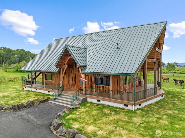 6238 Willow Grove Rd, Longview, WA 98632 - view of front of house with crawl space, a standing seam roof, covered porch, a front yard, and metal roof