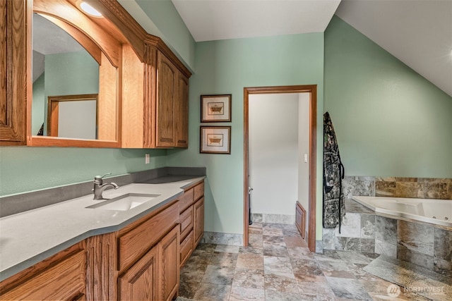 6238 Willow Grove Rd, Longview, WA 98632 - full bath featuring vanity, a garden tub, stone finish floors, and baseboards