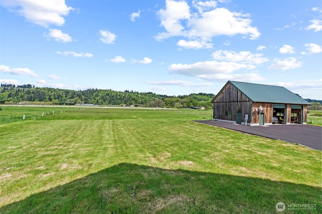 6238 Willow Grove Rd, Longview, WA 98632 - view of grassy yard with an outbuilding, an outdoor structure, a detached garage, and a rural view