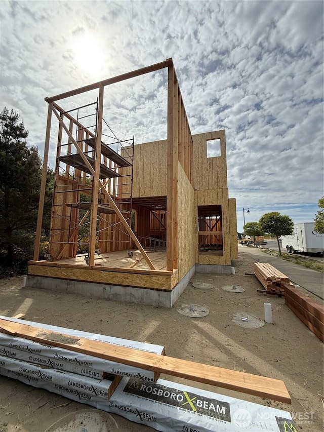 view of side of home with stairway