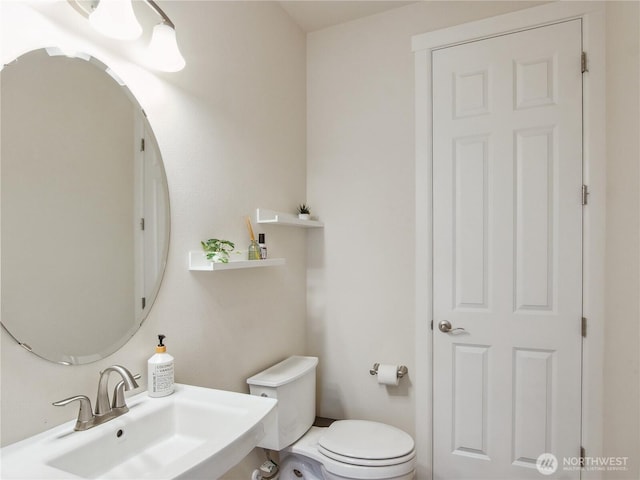 2668 83rd Avenue Ct E, Edgewood, WA 98371 - half bathroom featuring a sink and toilet