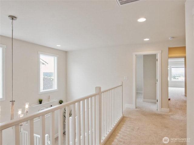 2668 83rd Avenue Ct E, Edgewood, WA 98371 - corridor featuring healthy amount of natural light, carpet flooring, recessed lighting, baseboards, and an upstairs landing