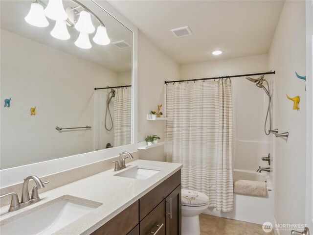 2668 83rd Avenue Ct E, Edgewood, WA 98371 - bathroom featuring toilet, shower / tub combo, double vanity, tile patterned flooring, and a chandelier