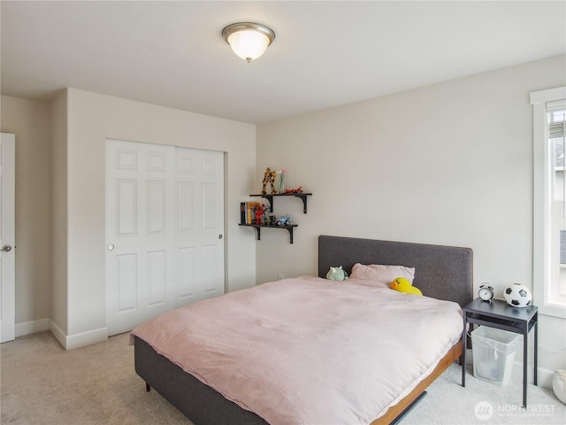 2668 83rd Avenue Ct E, Edgewood, WA 98371 - bedroom featuring carpet floors, baseboards, and a closet