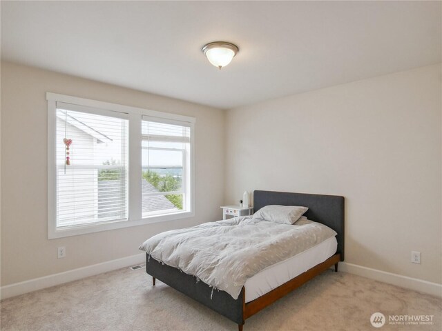 2668 83rd Avenue Ct E, Edgewood, WA 98371 - bedroom featuring baseboards and carpet