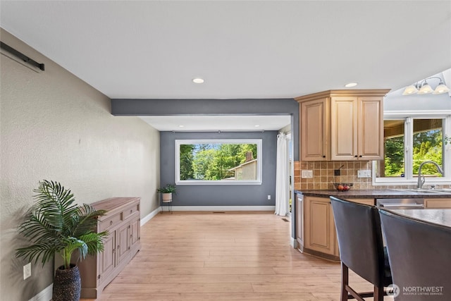 104 Point Fosdick Cir NW, Gig Harbor, WA 98335 - kitchen featuring baseboards, decorative backsplash, a sink, light wood finished floors, and recessed lighting
