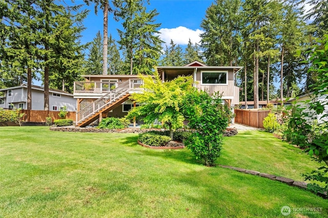 104 Point Fosdick Cir NW, Gig Harbor, WA 98335 - view of yard featuring stairs and a wooden deck