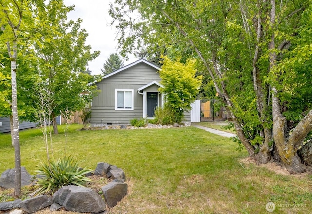 213 S 70th St, Tacoma, WA 98408 - view of property hidden behind natural elements featuring a front lawn and crawl space