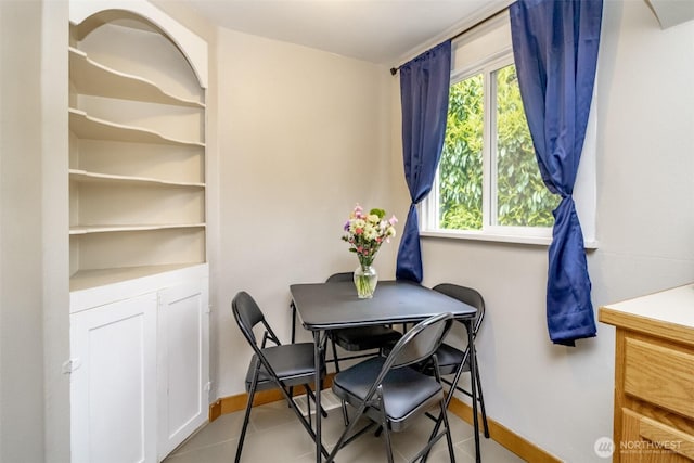 213 S 70th St, Tacoma, WA 98408 - dining room featuring baseboards and tile patterned floors