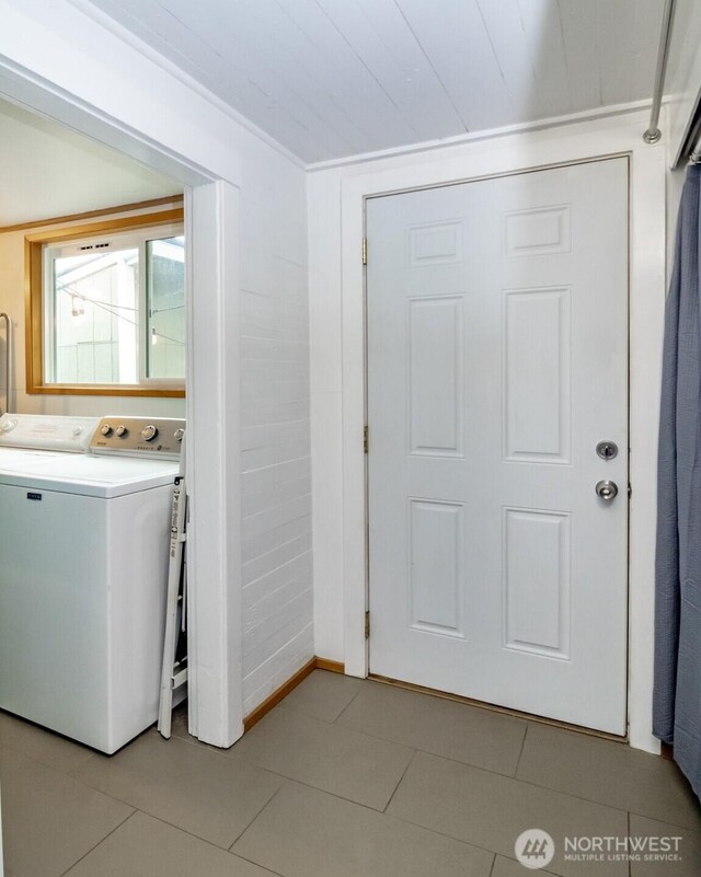 213 S 70th St, Tacoma, WA 98408 - washroom with washer / dryer and light tile patterned floors