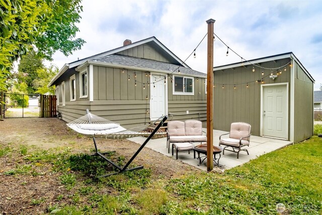 213 S 70th St, Tacoma, WA 98408 - rear view of property featuring a patio, roof with shingles, a gate, and board and batten siding