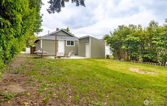 213 S 70th St, Tacoma, WA 98408 - rear view of property with a patio