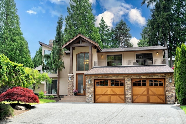 16915 SE 39th St, Bellevue, WA 98008 - view of front of home with a balcony, stucco siding, stone siding, driveway, and an attached garage
