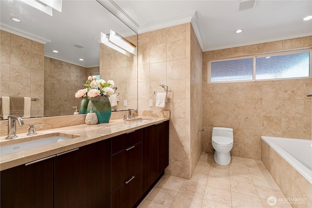 16915 SE 39th St, Bellevue, WA 98008 - bathroom with tile walls, crown molding, toilet, healthy amount of natural light, and tile patterned floors