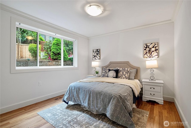16915 SE 39th St, Bellevue, WA 98008 - bedroom with crown molding, baseboards, and wood finished floors