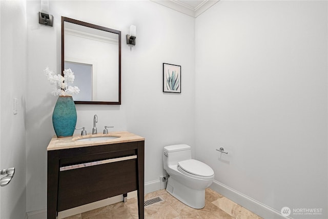 16915 SE 39th St, Bellevue, WA 98008 - half bathroom featuring crown molding, toilet, vanity, and baseboards