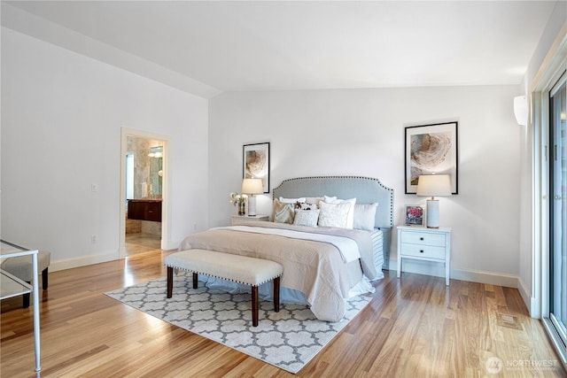 16915 SE 39th St, Bellevue, WA 98008 - bedroom with light wood-style flooring, baseboards, and lofted ceiling