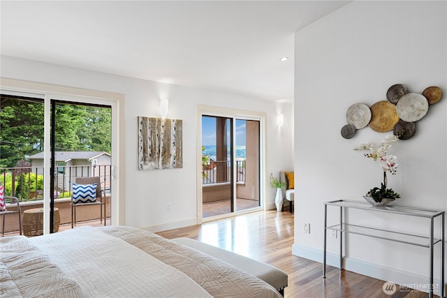 16915 SE 39th St, Bellevue, WA 98008 - bedroom featuring access to exterior, multiple windows, baseboards, wood finished floors, and recessed lighting