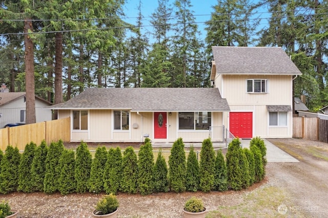 1115 207th Pl NE, Sammamish, WA 98074 - traditional-style home with a shingled roof, covered porch, and dirt driveway
