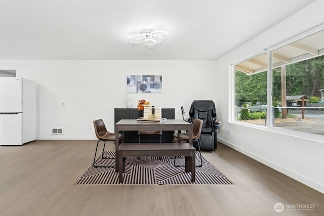 1115 207th Pl NE, Sammamish, WA 98074 - dining room featuring wood finished floors and baseboards