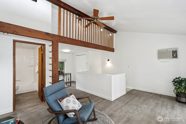 1115 207th Pl NE, Sammamish, WA 98074 - sitting room featuring wood finished floors, a wall mounted air conditioner, high vaulted ceiling, ceiling fan, and baseboards