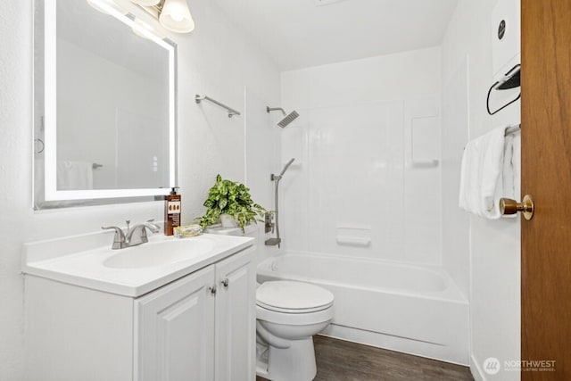 1115 207th Pl NE, Sammamish, WA 98074 - bathroom featuring toilet, vanity, wood finished floors, and shower / washtub combination