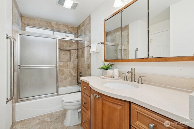 1115 207th Pl NE, Sammamish, WA 98074 - full bathroom featuring toilet, tile patterned flooring, vanity, and shower / bath combination with glass door