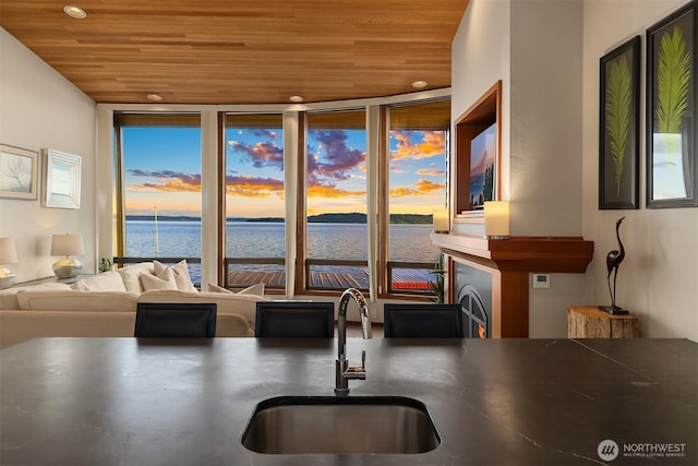 3316 SW 172nd St, Burien, WA 98166 - kitchen featuring wooden ceiling, a sink, floor to ceiling windows, a water view, and recessed lighting