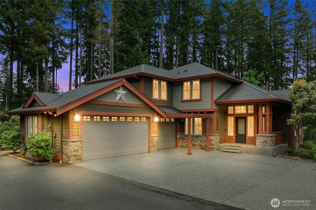 12331 3rd Ave NE, Marysville, WA 98271 - view of front facade with stone siding, driveway, an attached garage, and a shingled roof
