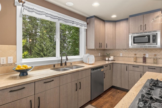 12331 3rd Ave NE, Marysville, WA 98271 - kitchen featuring appliances with stainless steel finishes, a sink, light stone counters, decorative backsplash, and recessed lighting
