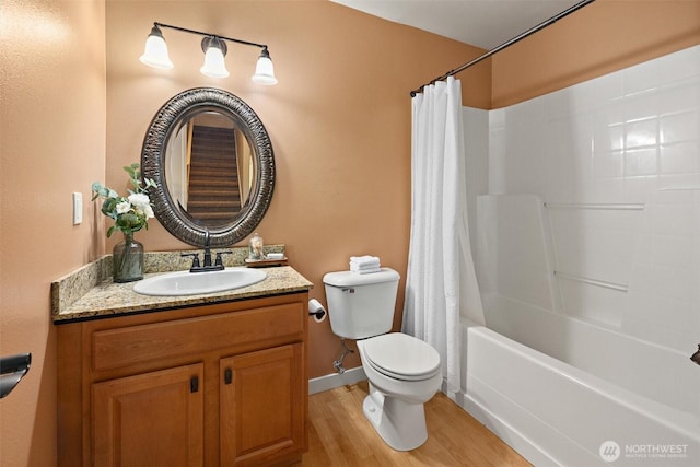 12331 3rd Ave NE, Marysville, WA 98271 - bathroom featuring wood finished floors, toilet, vanity, shower / bath combination with curtain, and baseboards