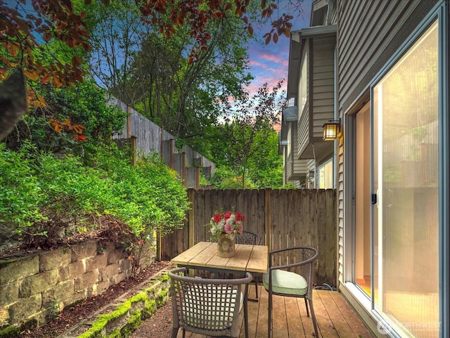 view of patio featuring fence and outdoor dining area