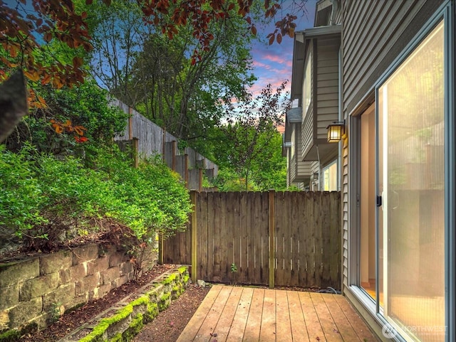 deck at dusk with fence