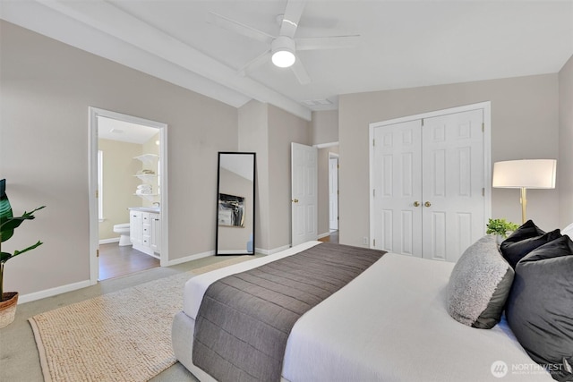 24053 223rd Ln SE, Maple Valley, WA 98038 - carpeted bedroom with lofted ceiling, a closet, ensuite bathroom, ceiling fan, and baseboards