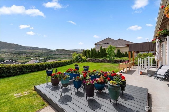2835 Aspen Shores Dr, East Wenatchee, WA 98802 - wooden terrace with a mountain view, a yard, and a patio area