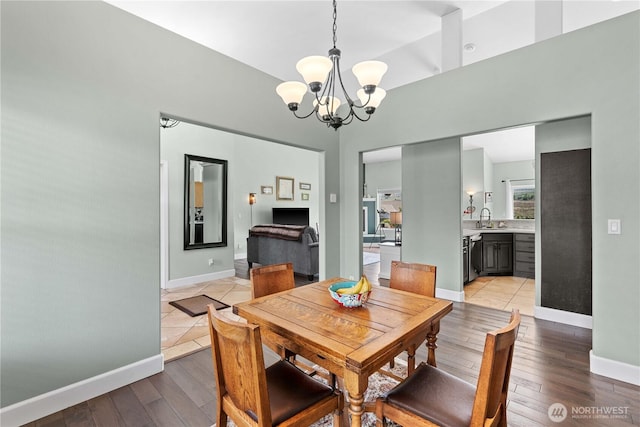 2835 Aspen Shores Dr, East Wenatchee, WA 98802 - dining space with a chandelier, light wood-type flooring, and baseboards