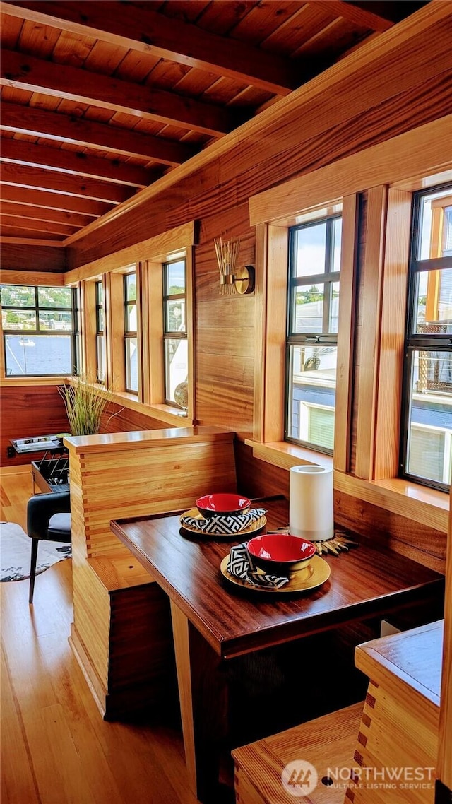 2040 Westlake Ave N Unit 17, Seattle, WA 98109 - dining room with beam ceiling, wood ceiling, wooden walls, wood finished floors, and breakfast area