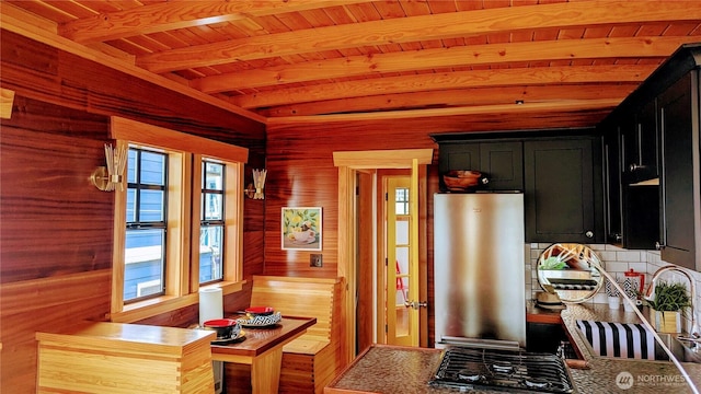 2040 Westlake Ave N Unit 17, Seattle, WA 98109 - kitchen with dark cabinets, beamed ceiling, wooden ceiling, wood walls, and a sink
