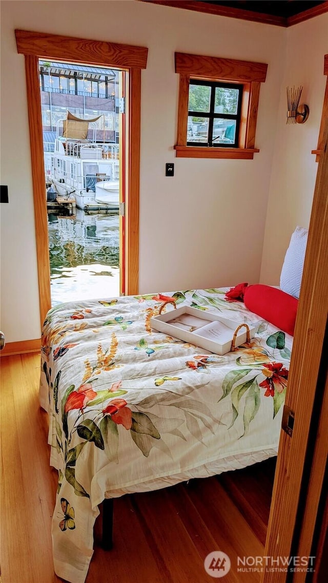 2040 Westlake Ave N Unit 17, Seattle, WA 98109 - bedroom featuring wood finished floors and baseboards