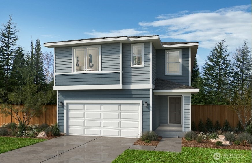 822 Smith St Unit 67, Buckley, WA 98321 - view of front of home featuring fence, a garage, and concrete driveway
