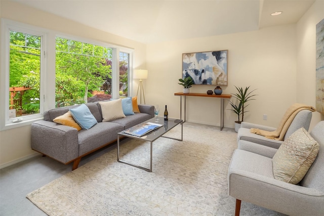 living area with carpet and baseboards