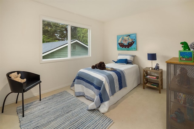 bedroom with carpet flooring and baseboards