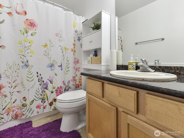 bathroom featuring tile patterned flooring, vanity, toilet, and a shower with curtain