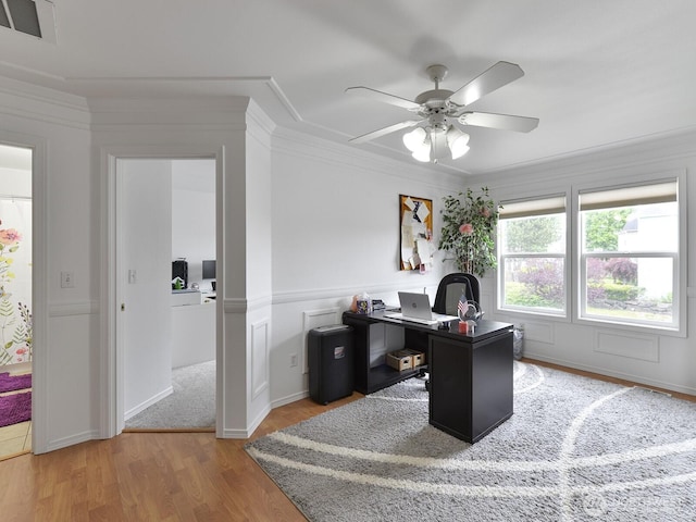 office area featuring ceiling fan, wood finished floors, and crown molding