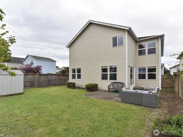 rear view of house featuring outdoor lounge area, a patio area, a shed, and an outdoor structure