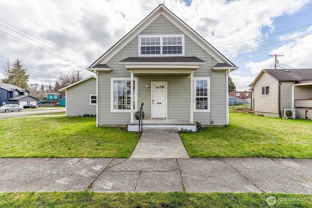 116 E 4th St, Centralia, WA 98531 - view of front facade featuring a front lawn and ac unit