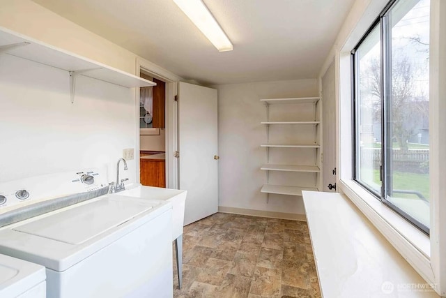 116 E 4th St, Centralia, WA 98531 - laundry area with stone finish floors, independent washer and dryer, and baseboards