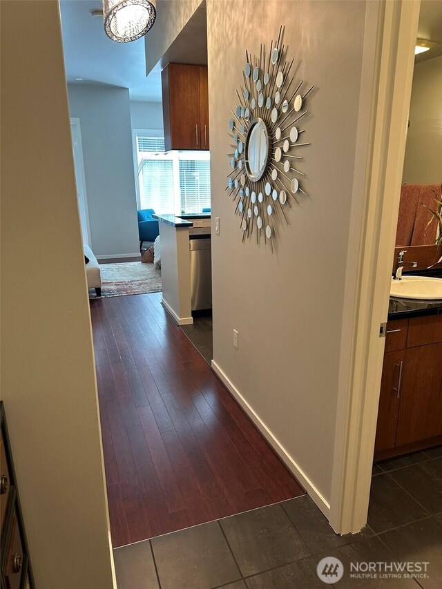 2721 1st Ave Unit 103, Seattle, WA 98121 - corridor with a sink and baseboards